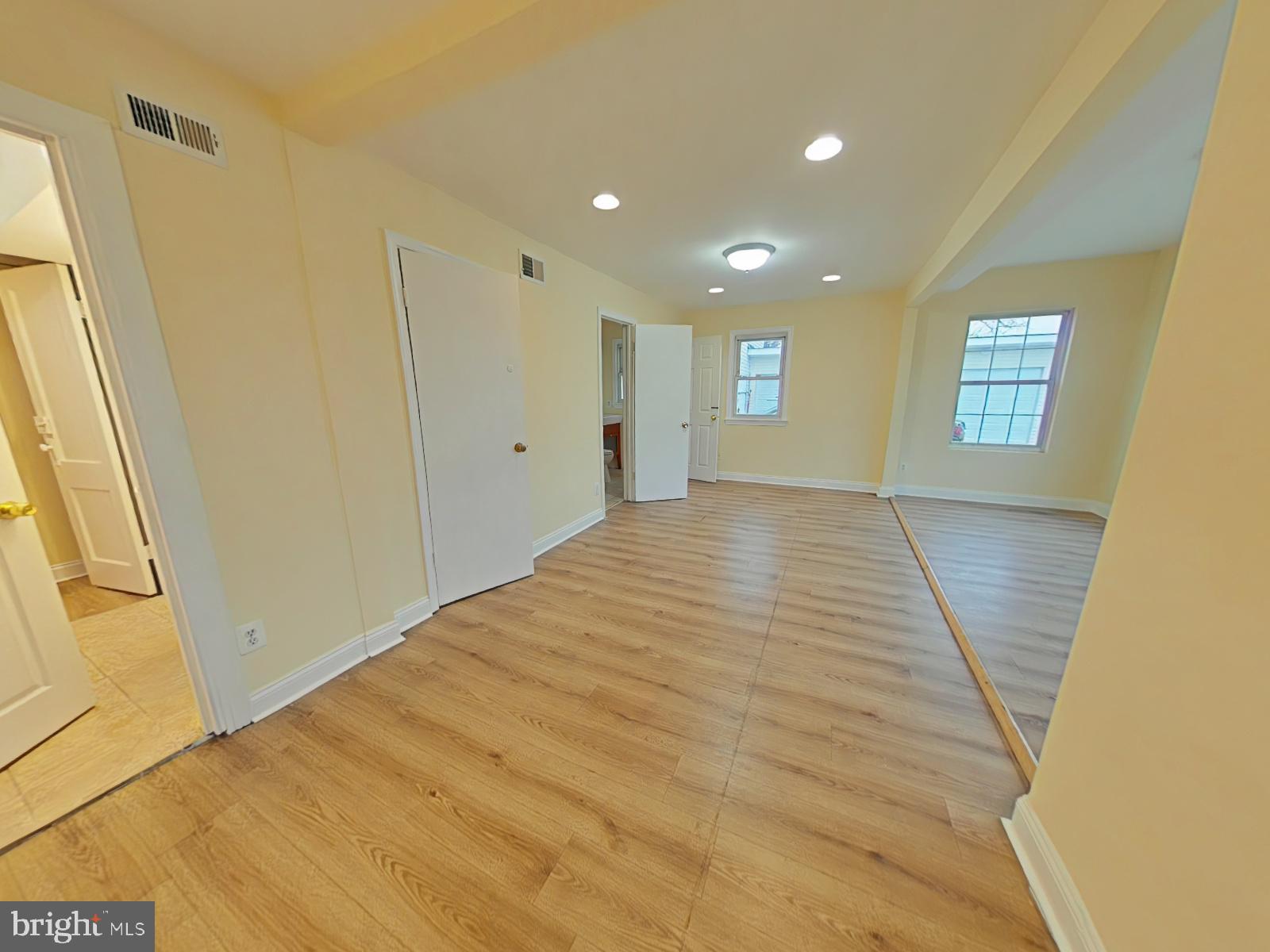 8611 Westphalia Road Upper Marlboro, MD 20772 - Photo 11 of 26 a view of empty room with wooden floor and fan