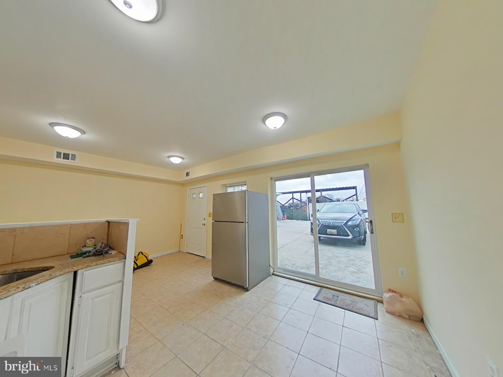 8611 Westphalia Road Upper Marlboro, MD 20772 - Photo 12 of 26 a view of a storage & utility room with two washing machine