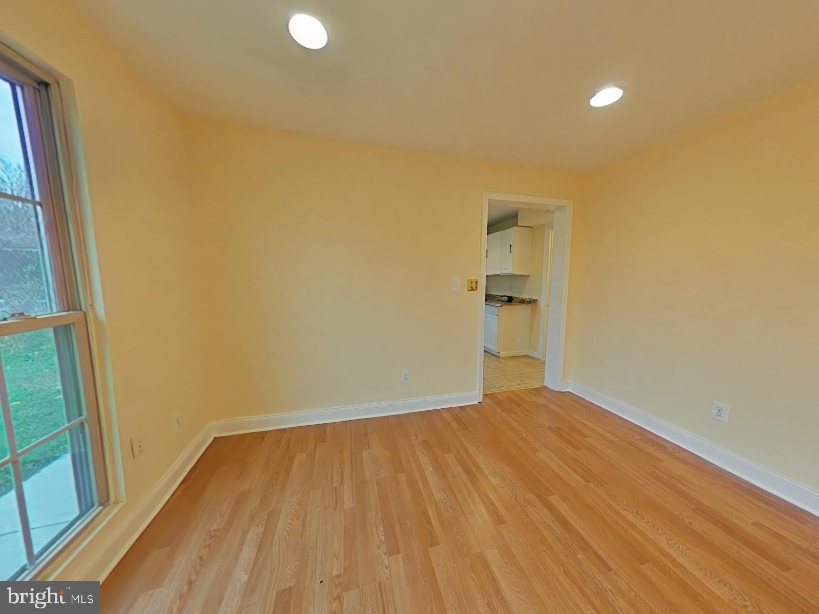 8611 Westphalia Road Upper Marlboro, MD 20772 - Photo 14 of 26 a view of empty room with wooden floor and fan