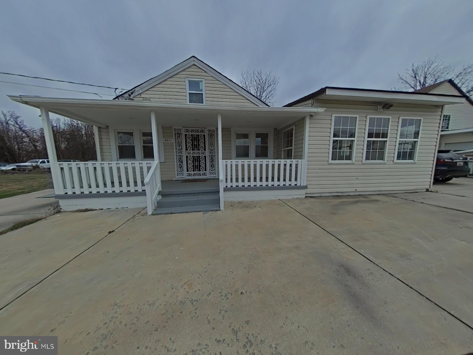 8611 Westphalia Road Upper Marlboro, MD 20772 - Photo 2 of 26 front view of a house with a porch
