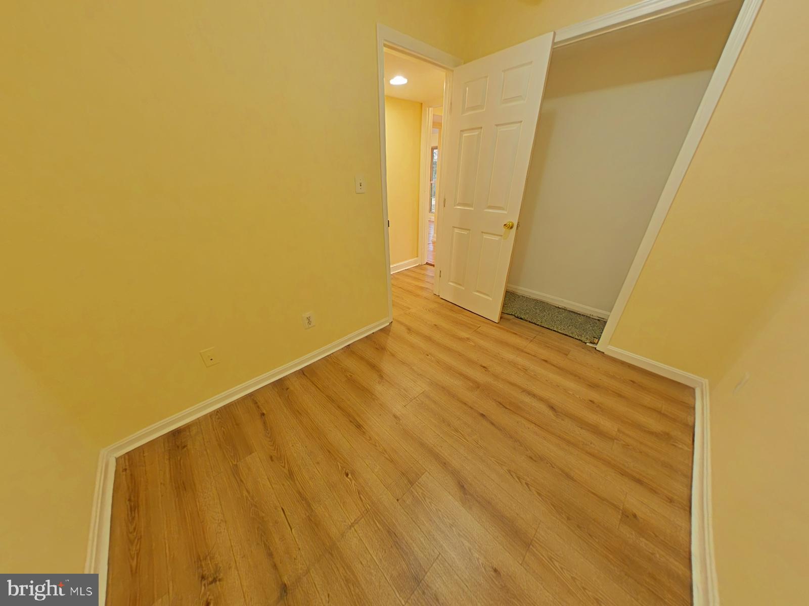 8611 Westphalia Road Upper Marlboro, MD 20772 - Photo 6 of 26 a view of an empty room with wooden floor