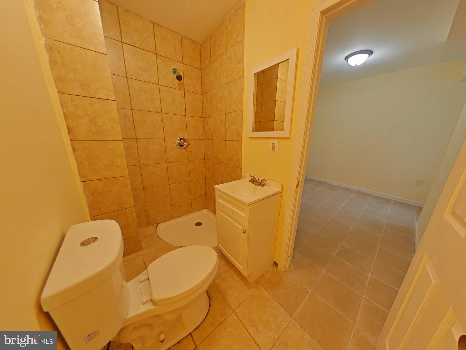 8611 Westphalia Road Upper Marlboro, MD 20772 - Photo 8 of 26 a bathroom with a toilet and shower