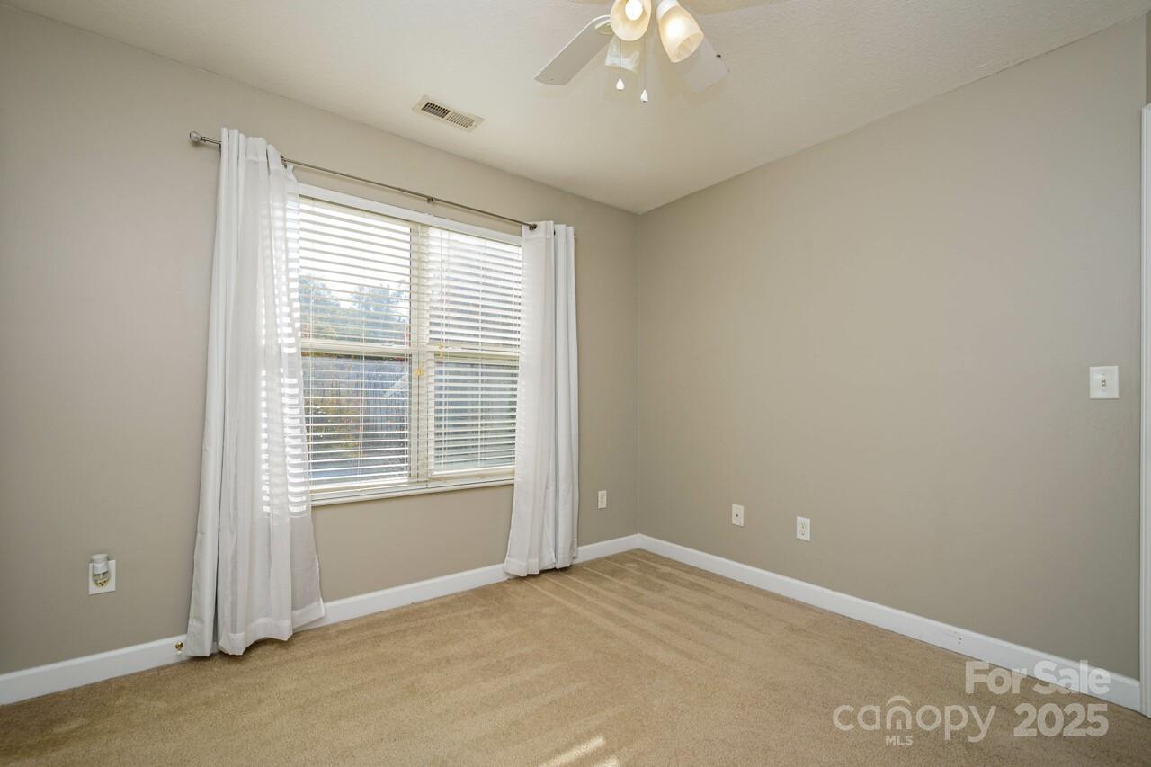 606 Olde Covington Way Arden, NC 28704 - Photo 35 of 38 a view of an empty room with a window