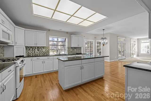 a dining room with furniture window wooden floor