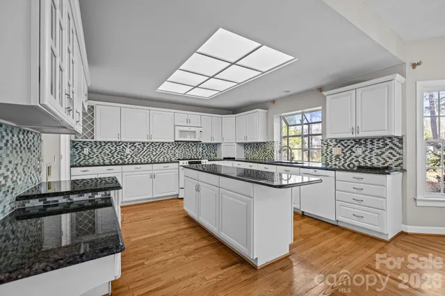 a living room with furniture flat screen tv and a fireplace