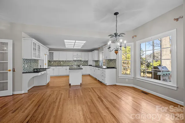 a swimming pool with outdoor seating and yard