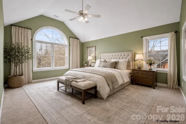 a bedroom with a bed and window