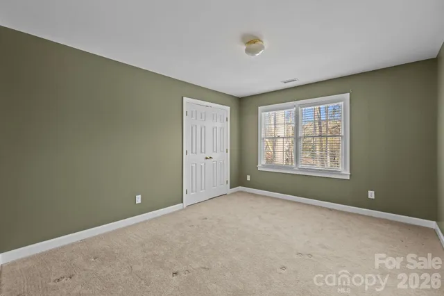 a view of a park with large trees