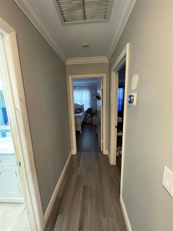 9020 Pine Springs Drive Boca Raton, FL 33428 - Photo 12 of 21 a view of a hallway view with wooden floor and staircase