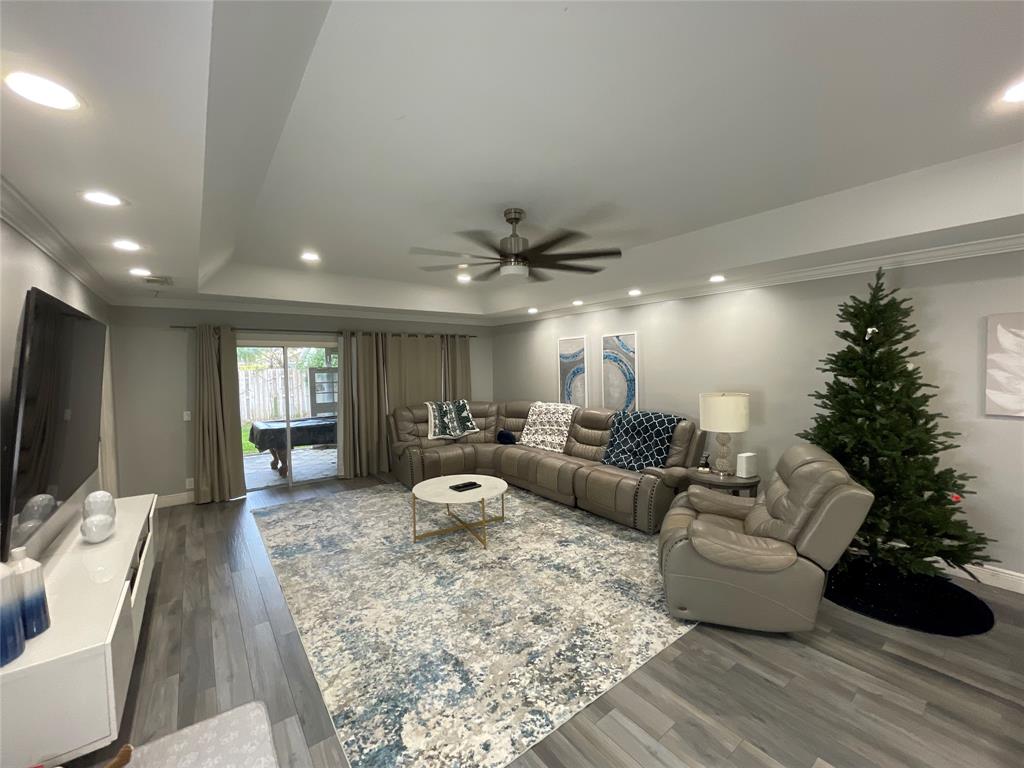 9020 Pine Springs Drive Boca Raton, FL 33428 - Photo 18 of 21 a living room with furniture and a flat screen tv