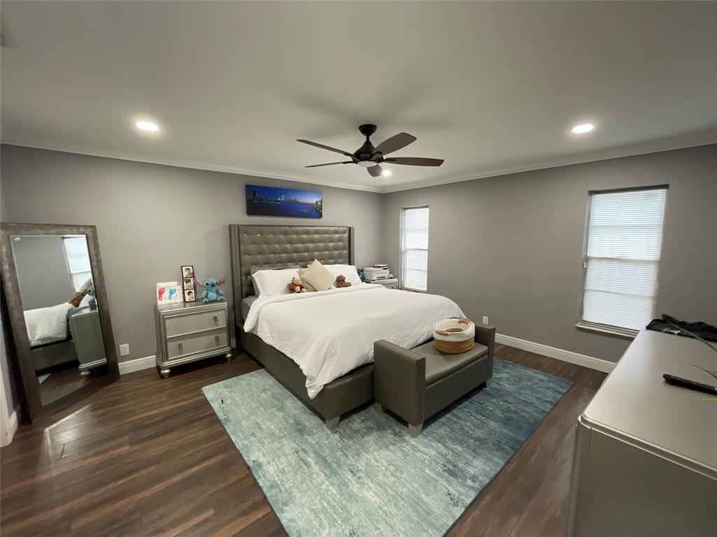 9020 Pine Springs Drive Boca Raton, FL 33428 - Photo 8 of 21 a bedroom with a bed window and a ceiling fan