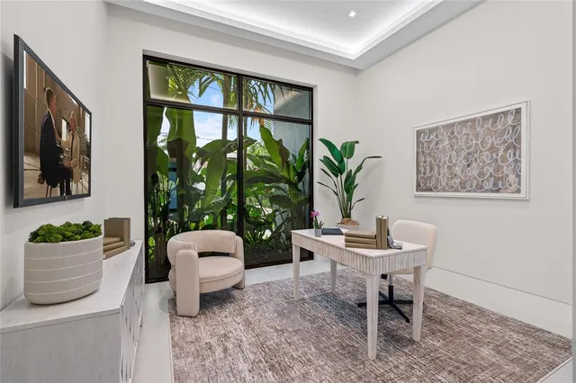 a spacious bedroom with a large bed and a large window