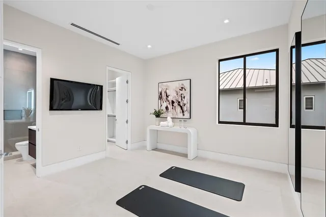 a view of a kitchen with a refrigerator and a stove