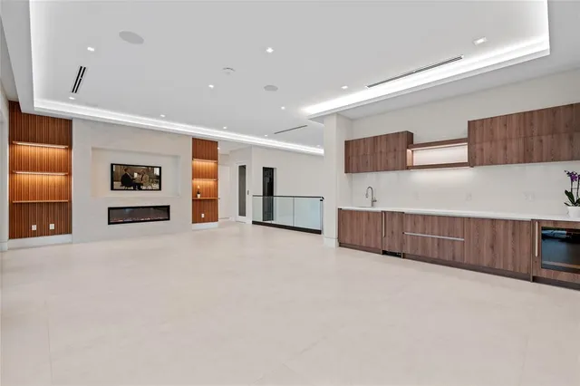 a bedroom with furniture and large windows