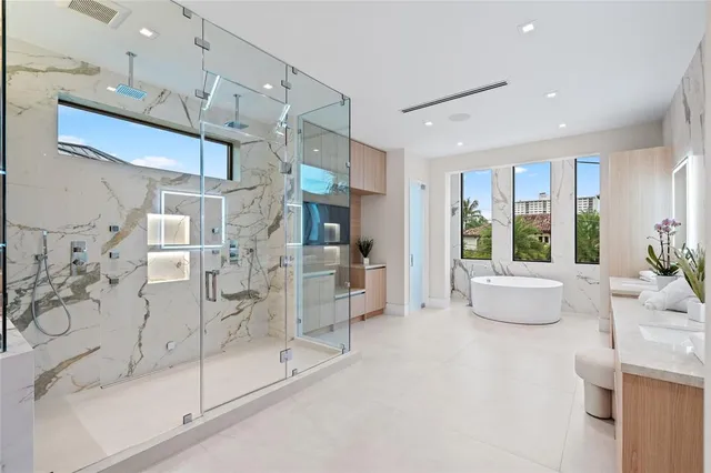 a view of swimming pool with outdoor seating and plants