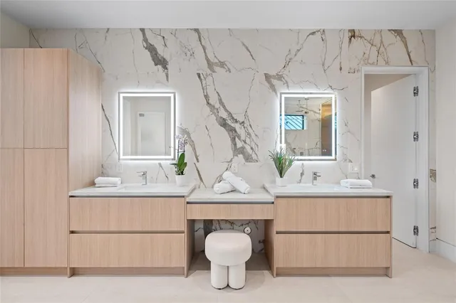 a bathroom with a sink a toilet and tub