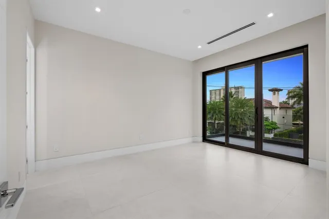 a view of a house with pool and sitting area