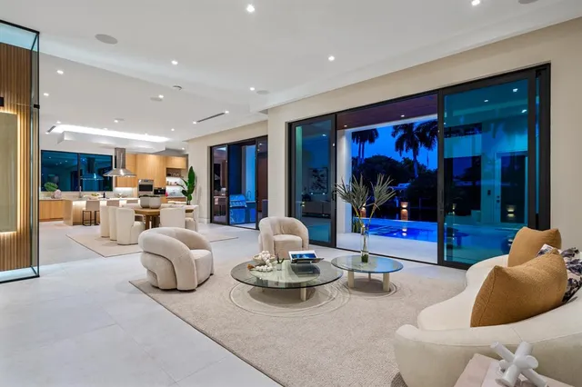 an aerial view of a house with a garden and lake view