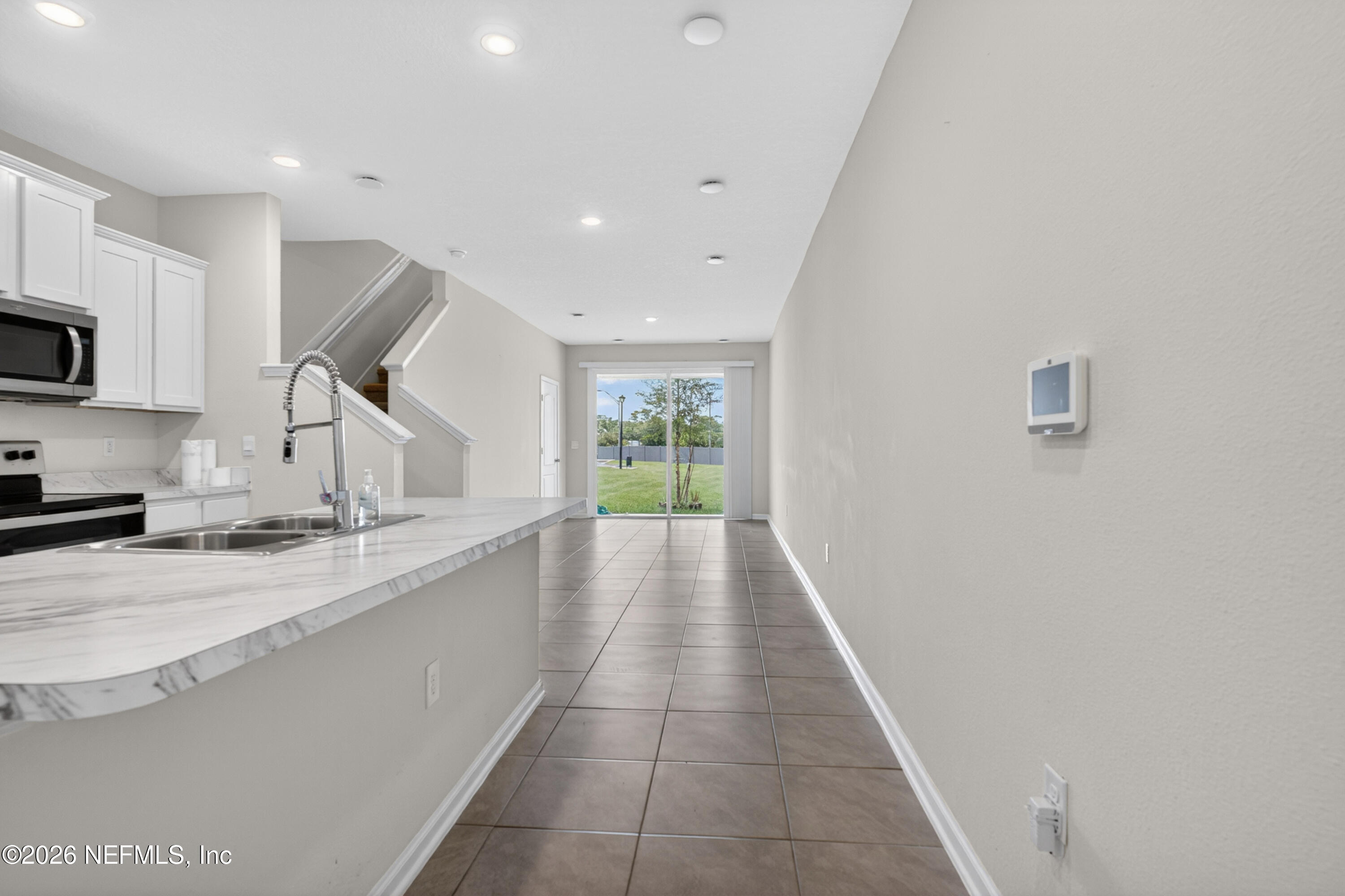 8210 Larose Road Jacksonville, FL 32211 - Photo 3 of 38 a view of a kitchen with a sink and a window
