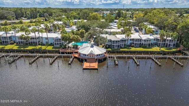 a swimming pool with outdoor seating and yard