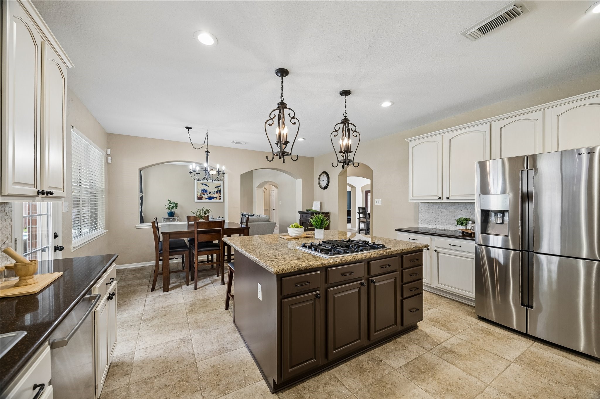 9122 Memorial Valley Drive Spring, TX 77379 - Photo 13 of 35 a kitchen with a sink stove and cabinets