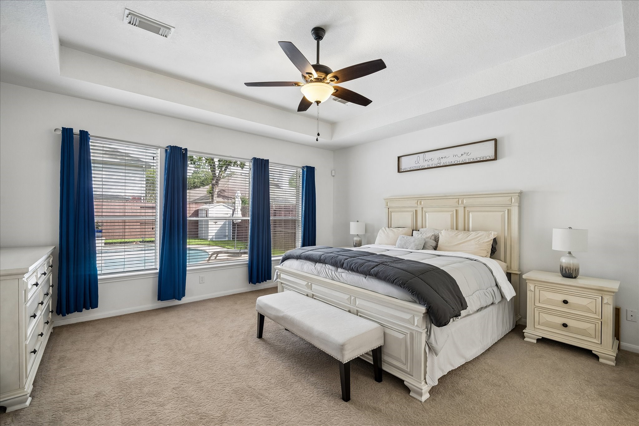 9122 Memorial Valley Drive Spring, TX 77379 - Photo 15 of 35 a spacious bedroom with a bed and a ceiling fan