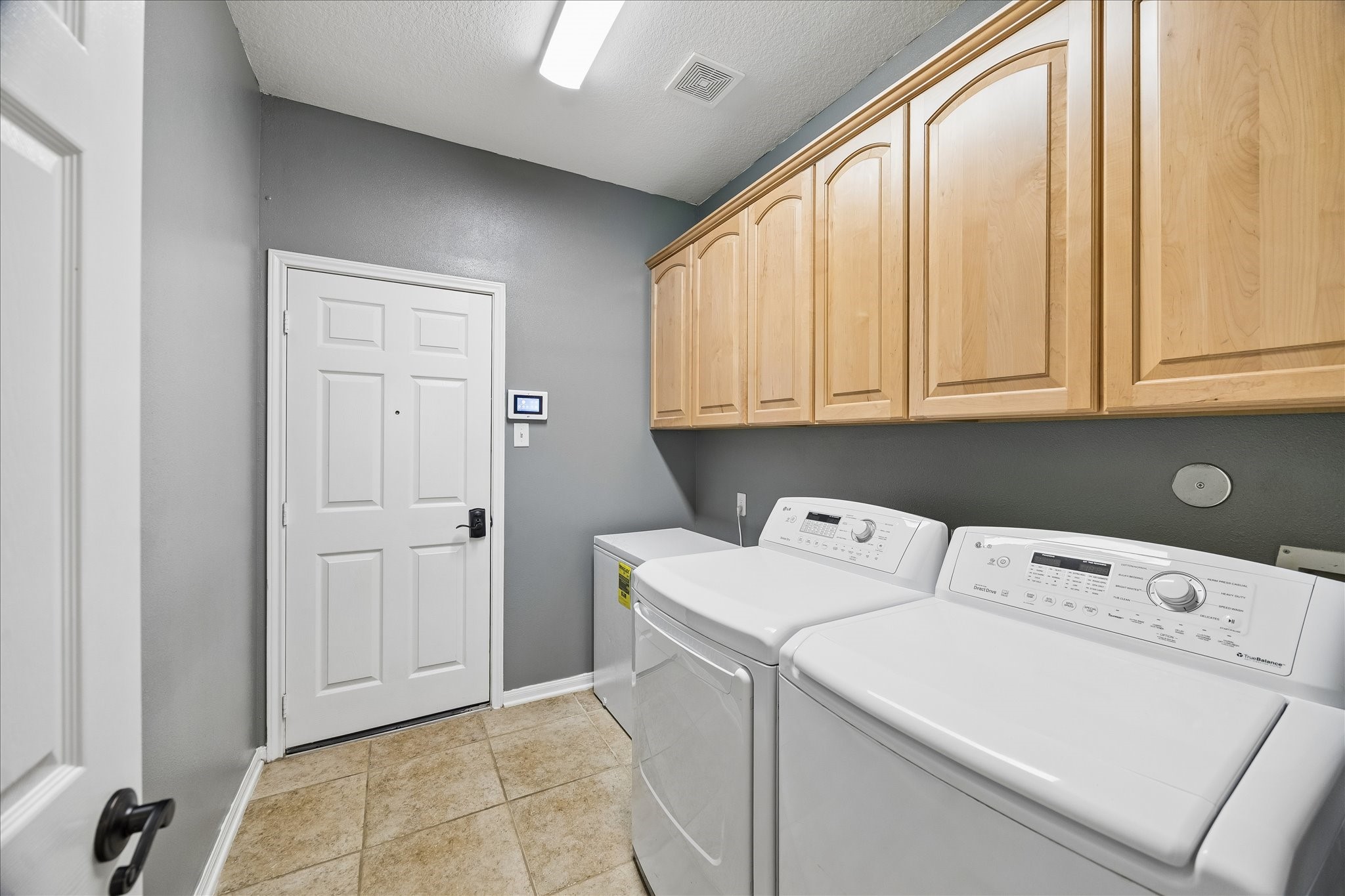 9122 Memorial Valley Drive Spring, TX 77379 - Photo 21 of 35 a utility room with dryer and washer