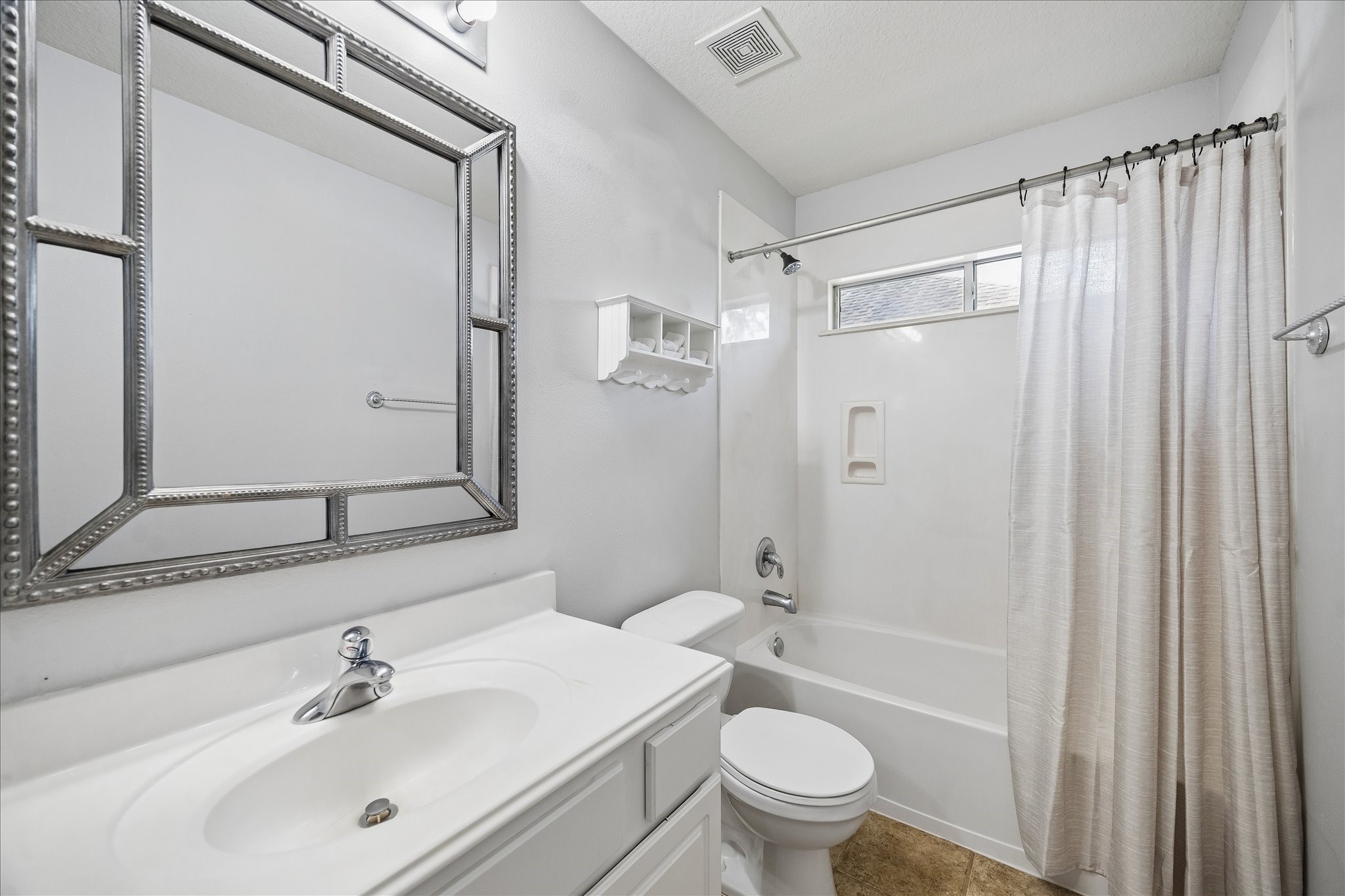 9122 Memorial Valley Drive Spring, TX 77379 - Photo 24 of 35 a bathroom with a sink a toilet and shower