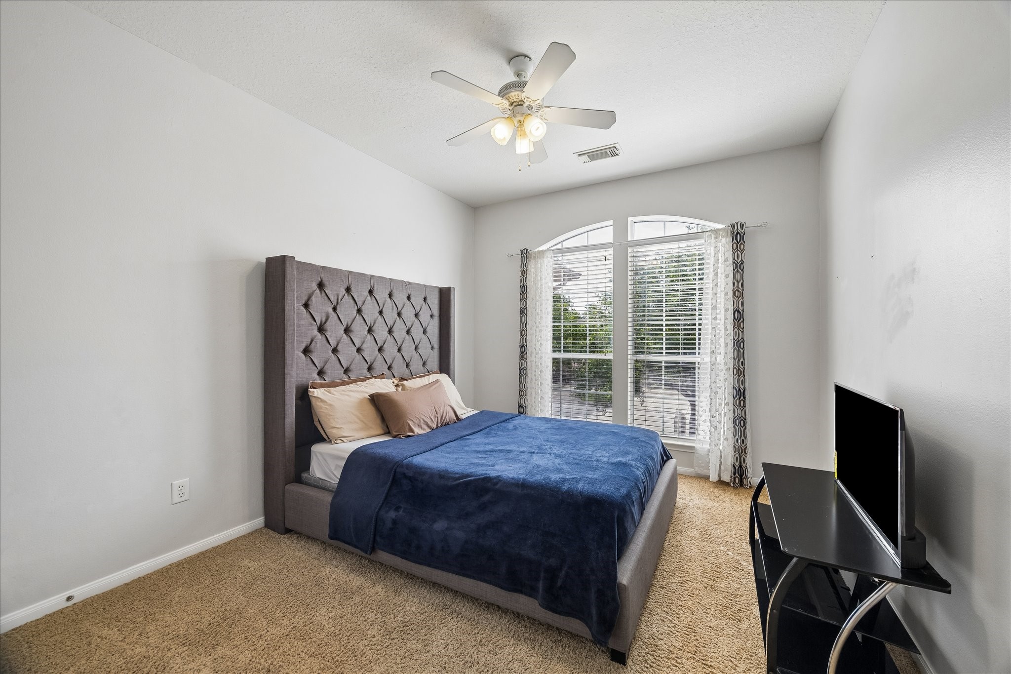 9122 Memorial Valley Drive Spring, TX 77379 - Photo 25 of 35 a bedroom with a bed and window