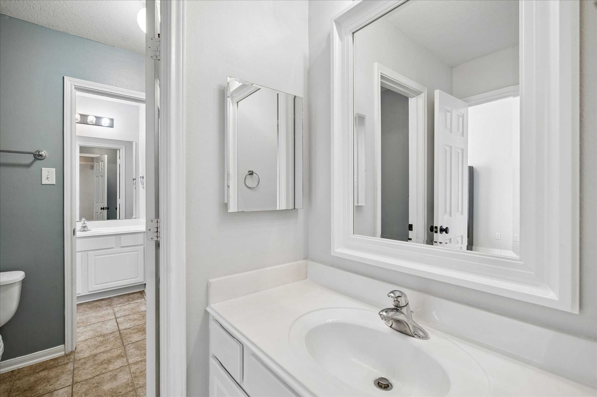 9122 Memorial Valley Drive Spring, TX 77379 - Photo 27 of 35 a bathroom with a sink and a mirror