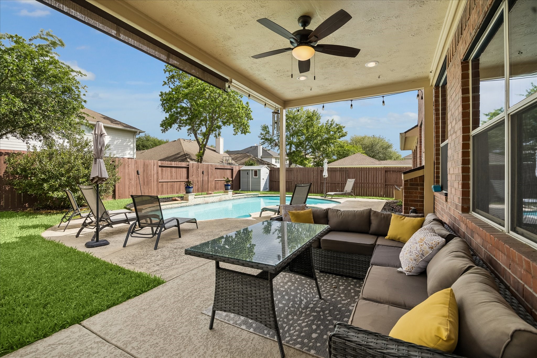 9122 Memorial Valley Drive Spring, TX 77379 - Photo 29 of 35 a outdoor space with patio the couches and a dining table with garden view