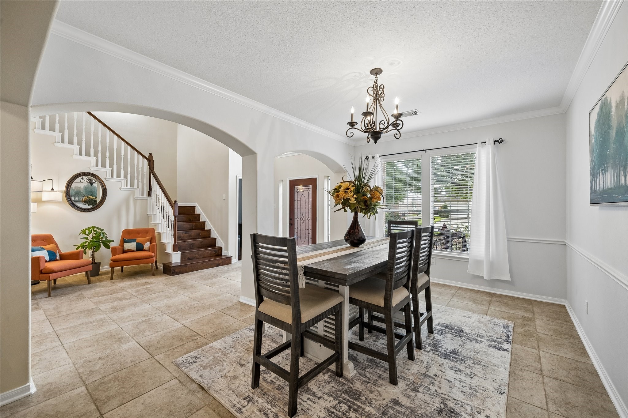 9122 Memorial Valley Drive Spring, TX 77379 - Photo 5 of 35 a view of a dining room with furniture and a chandelier