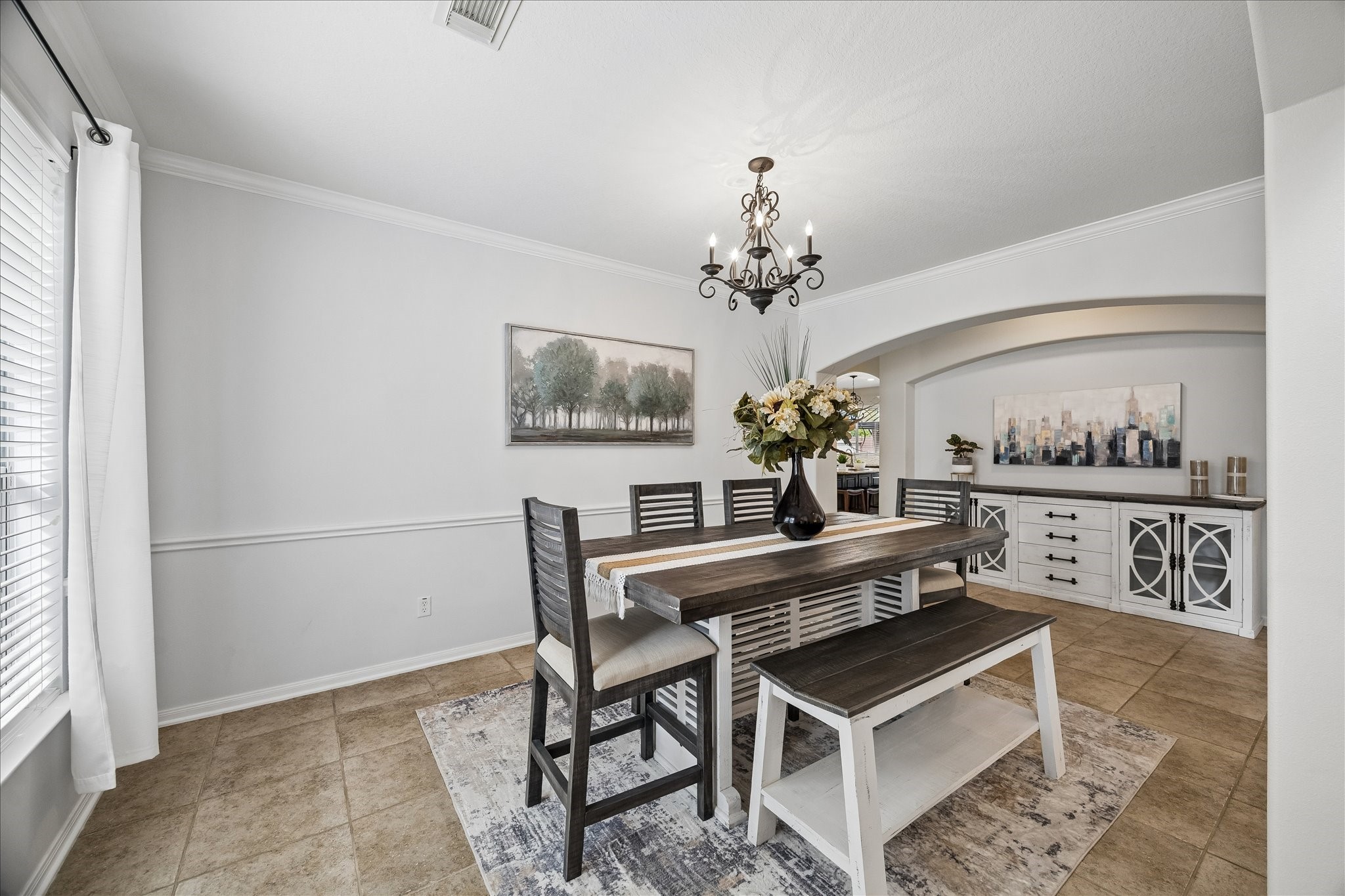 9122 Memorial Valley Drive Spring, TX 77379 - Photo 6 of 35 a dining room with furniture and chandelier