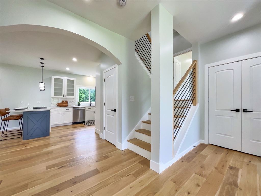 101 N Road Westfield, MA 01085 - Photo 16 of 40 a view of a hallway with wooden floor and staircase