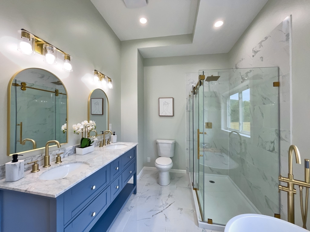 101 N Road Westfield, MA 01085 - Photo 27 of 40 a spacious bathroom with a double vanity sink toilet mirror and double