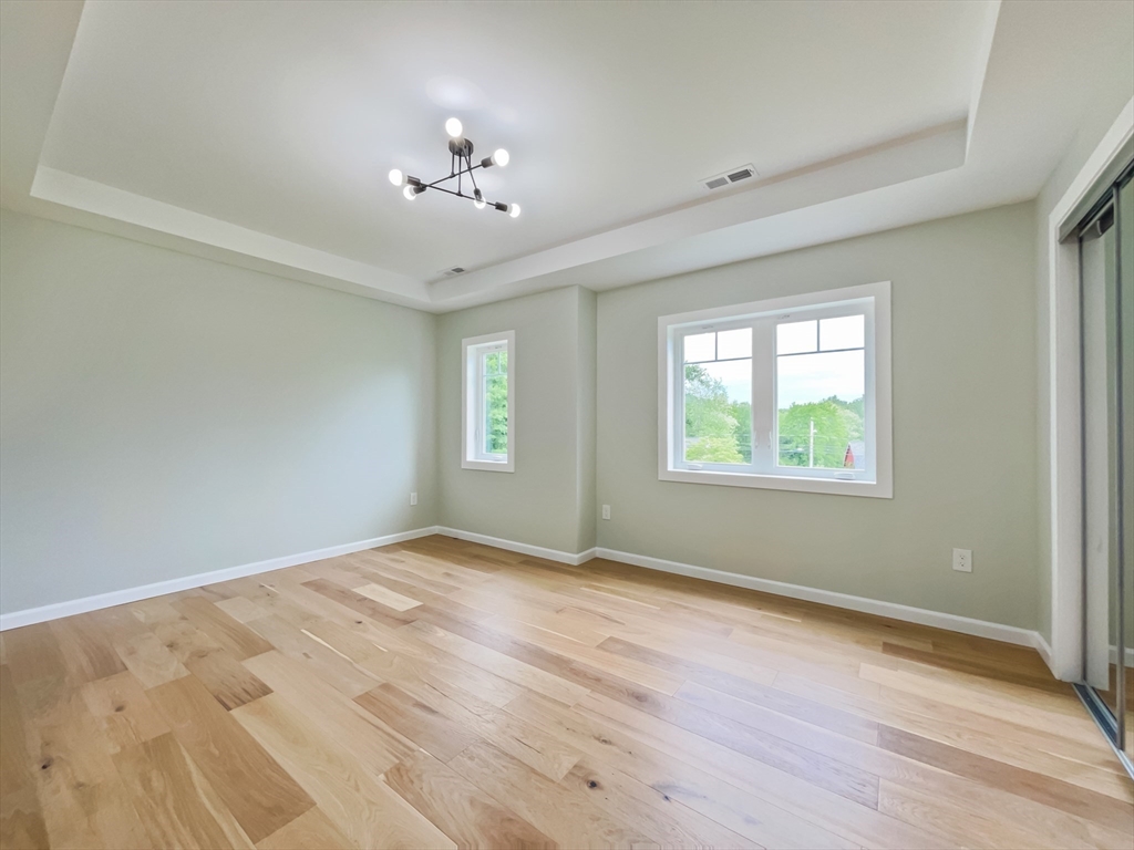 101 N Road Westfield, MA 01085 - Photo 31 of 40 a view of an empty room with wooden floor and a window