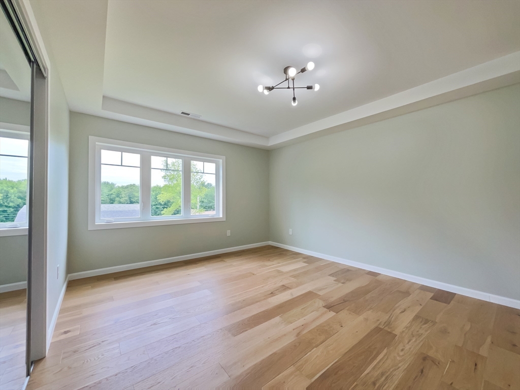 101 N Road Westfield, MA 01085 - Photo 33 of 40 a view of an empty room with a window and wooden floor