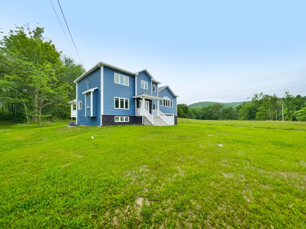101 N Road Westfield, MA 01085 - Photo 4 of 40 a front view of house with yard and green space