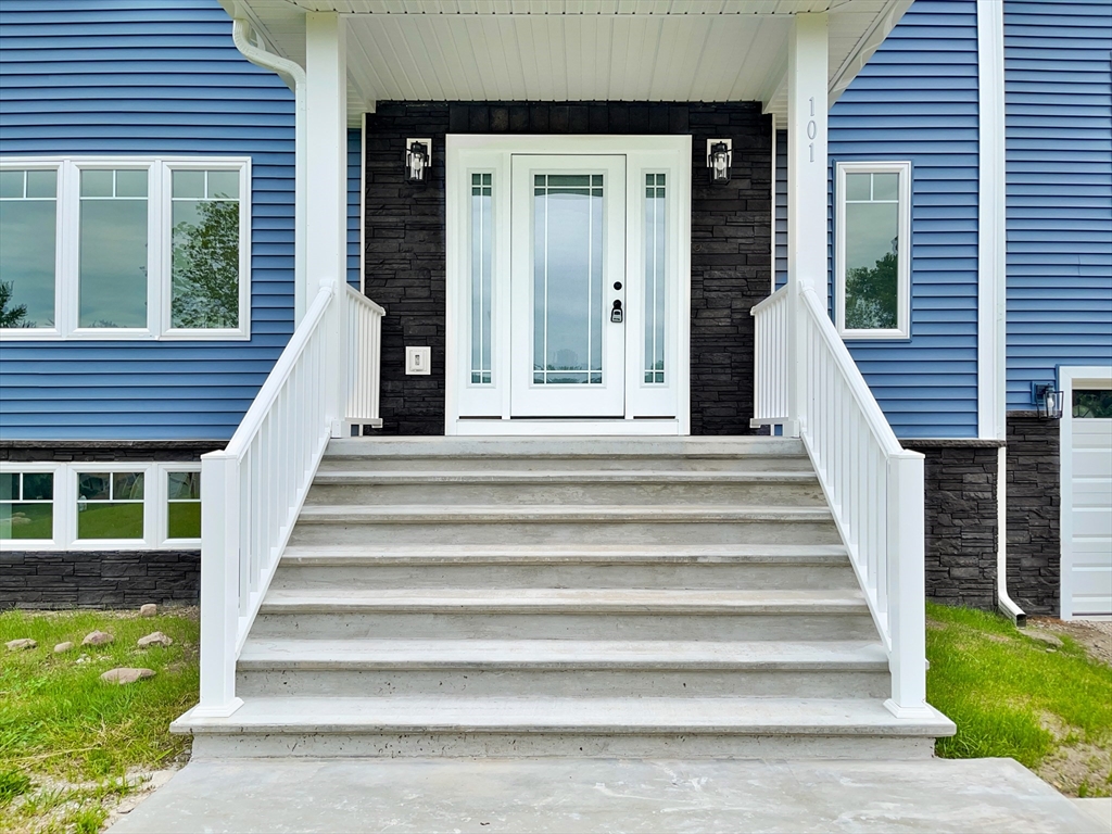 101 N Road Westfield, MA 01085 - Photo 5 of 40 a view of a house with entryway and a small yard