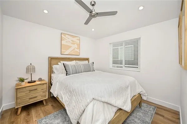 a bedroom with bed and window