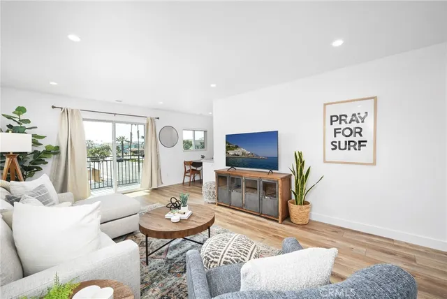 a spacious bathroom with a granite countertop toilet sink and mirror