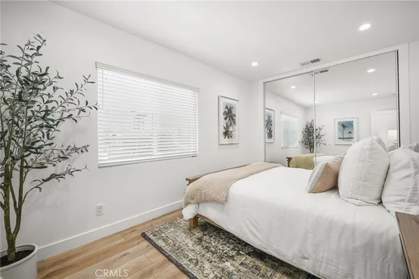 a bedroom with two beds and painted walls