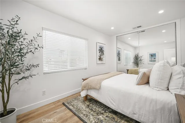 a bedroom with two beds and painted walls