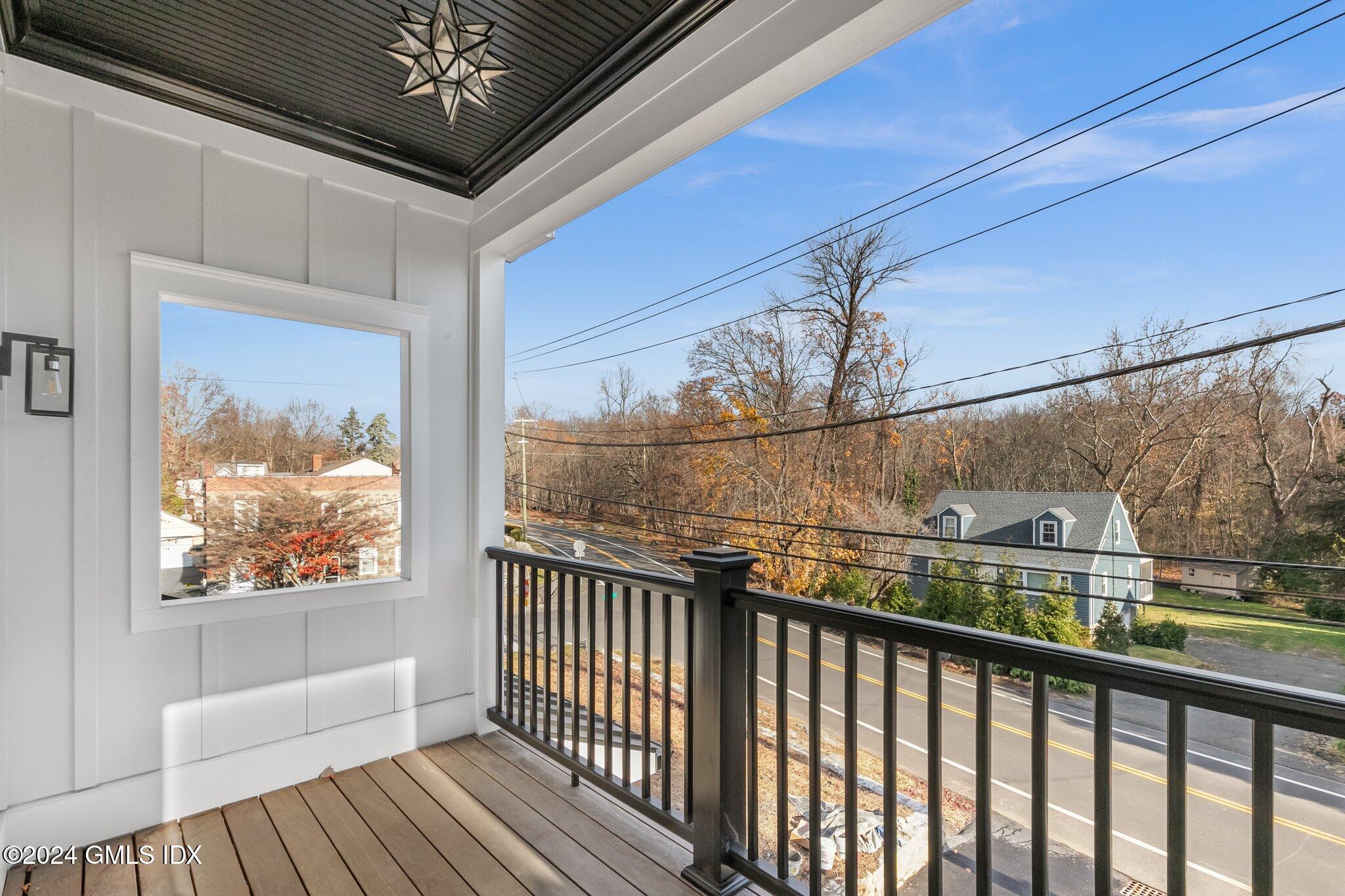 96 Weaver Street, Unit A Greenwich, CT 06831 - Photo 15 of 26 a view of balcony with wooden floor