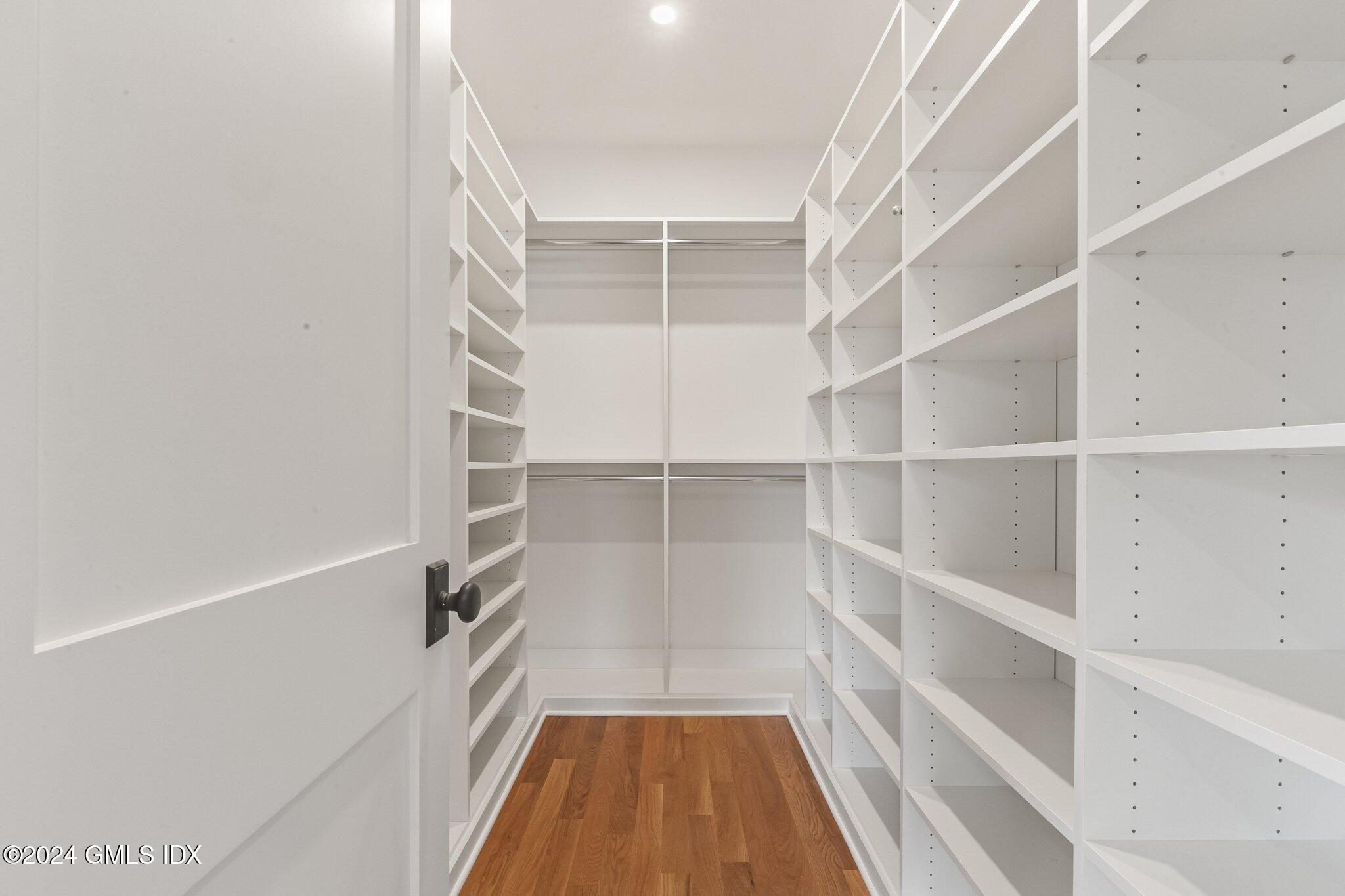 96 Weaver Street, Unit A Greenwich, CT 06831 - Photo 21 of 26 a view of walk in closet with empty racks