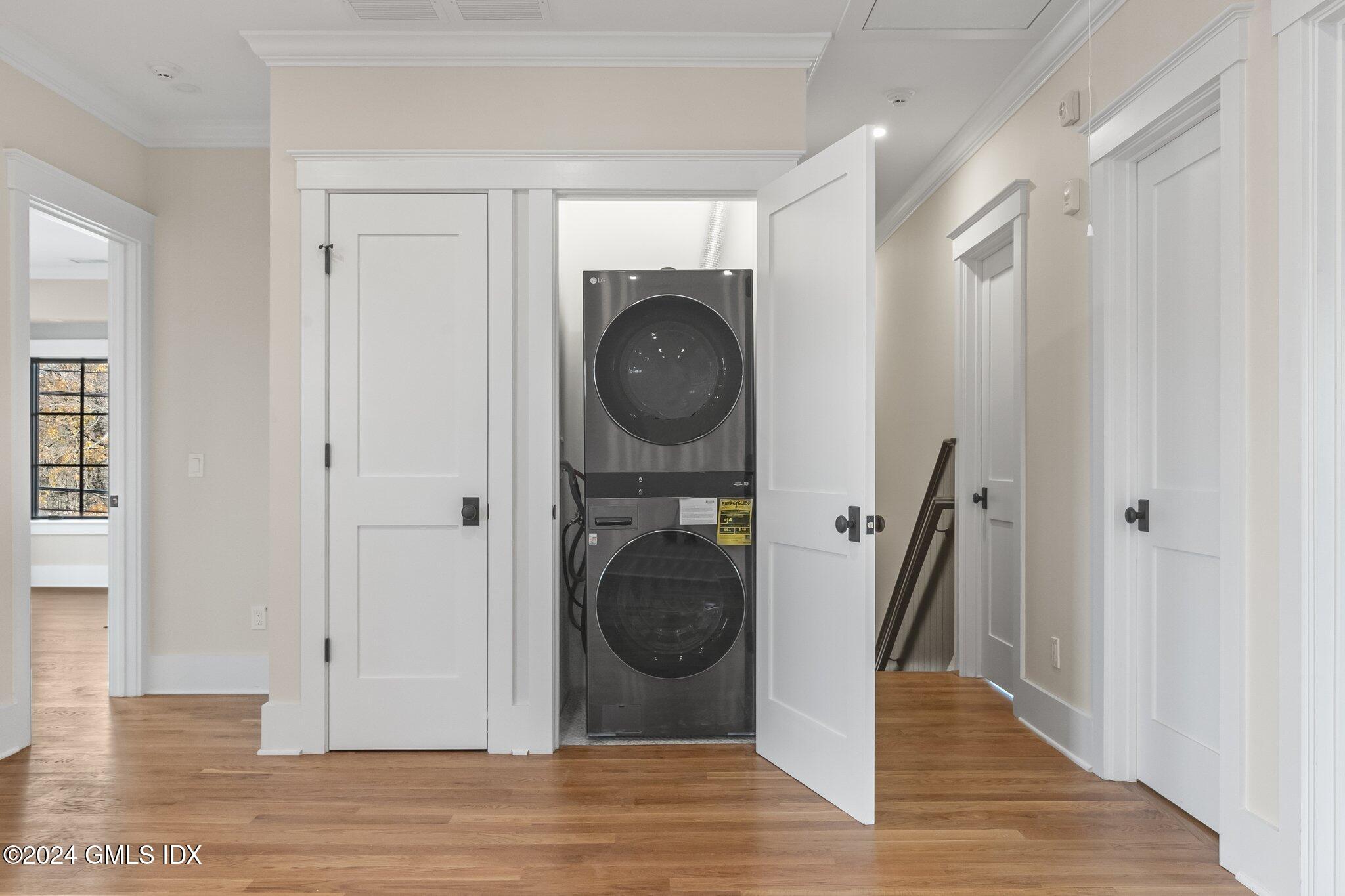 96 Weaver Street, Unit A Greenwich, CT 06831 - Photo 5 of 26 a view of a hallway with washer and dryer