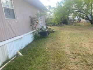 105 Concho Street, Unit A Tye, TX 79563 - Photo 8 of 8 a view of a back yard