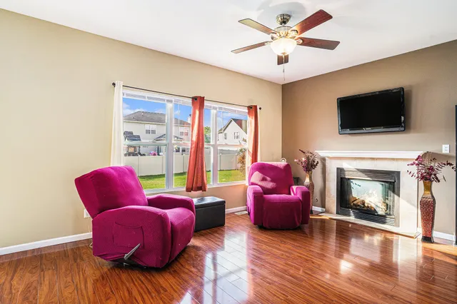 a living room with furniture or flat screen tv and a fireplace
