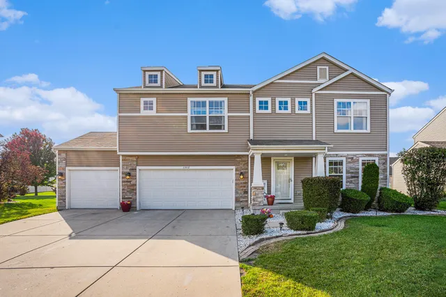 a front view of a house with a yard