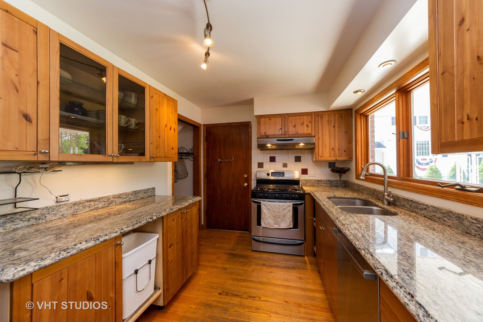 403 North Plum Grove Road Palatine, IL 60067 - Photo 2 of 11 a kitchen with stainless steel appliances granite countertop a sink a stove and a refrigerator
